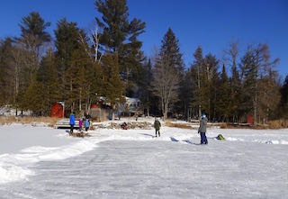 Photo of Macoun Club group on the ice