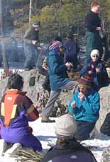 Photo of Macoun Club group having lunch on a frozen beaver pond
