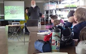 Photo of Roy John talking about birds to Macoun Field Club